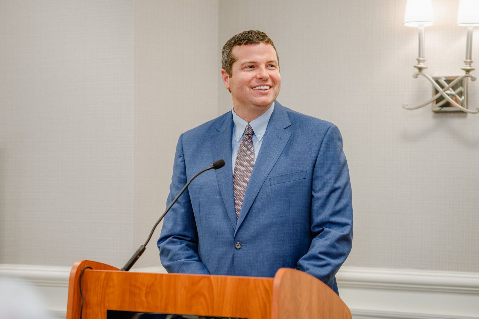 Ross helps present an award to a lawyer colleague.